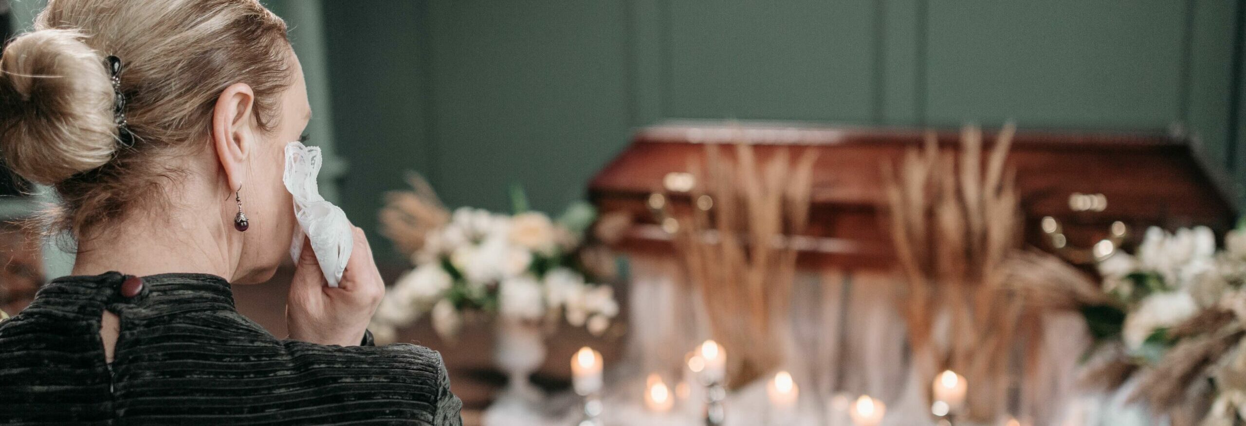 woman grieving at funeral